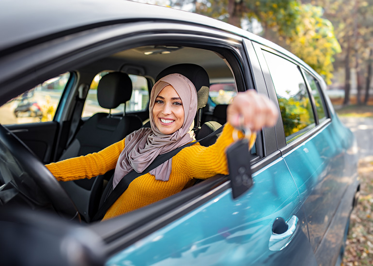 Young woman with car keys